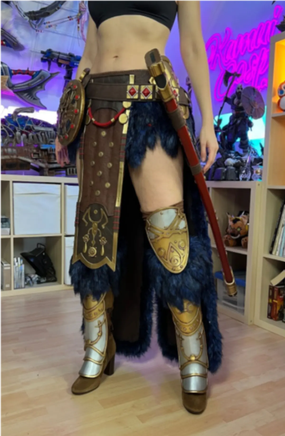 Belt, leg armor and shield on display.